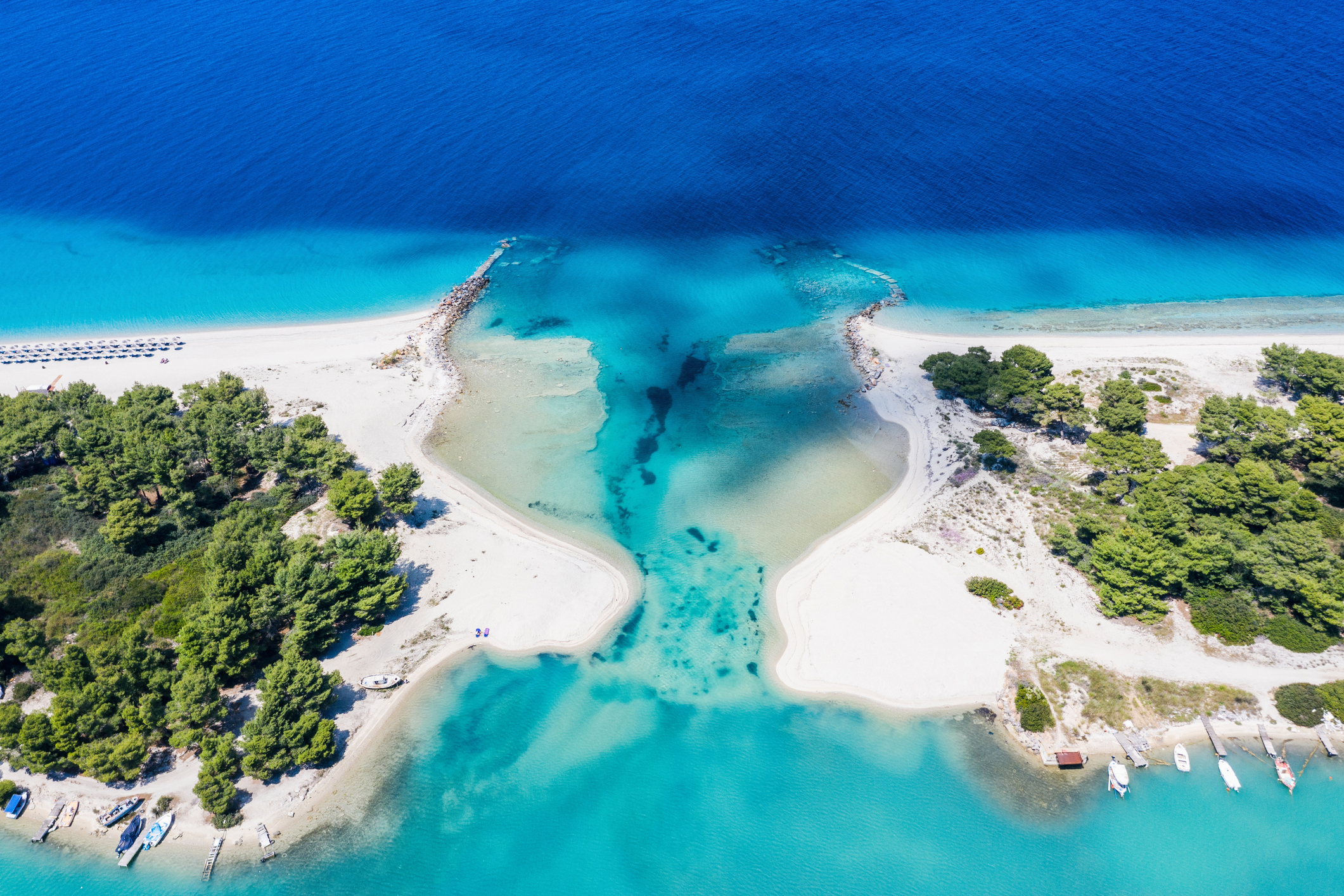 Aerial drone view of Port Glarokavos and lagoon beach in Kassandra Chalkidiki Greece