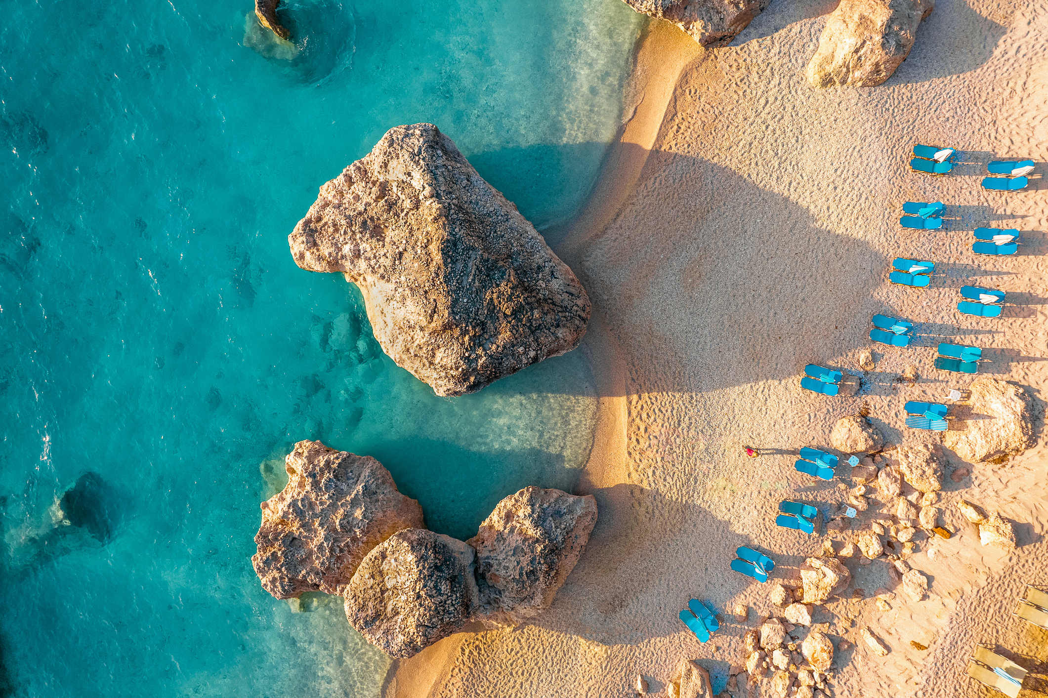 Aerial view of sun chairs and beach in Greece