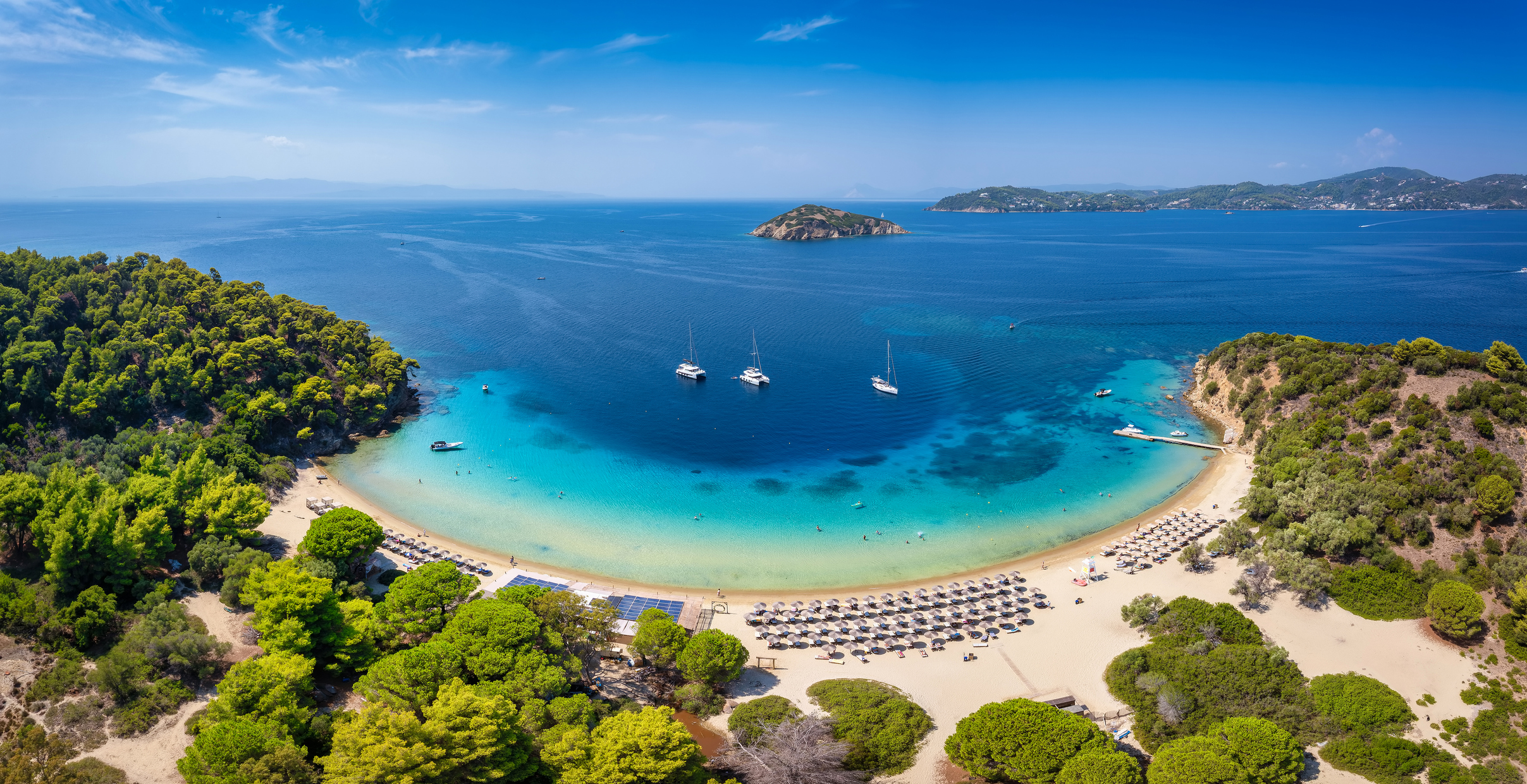 Panoramic aerial view of the beautiful beach and turquoise sea at Tsougrias island