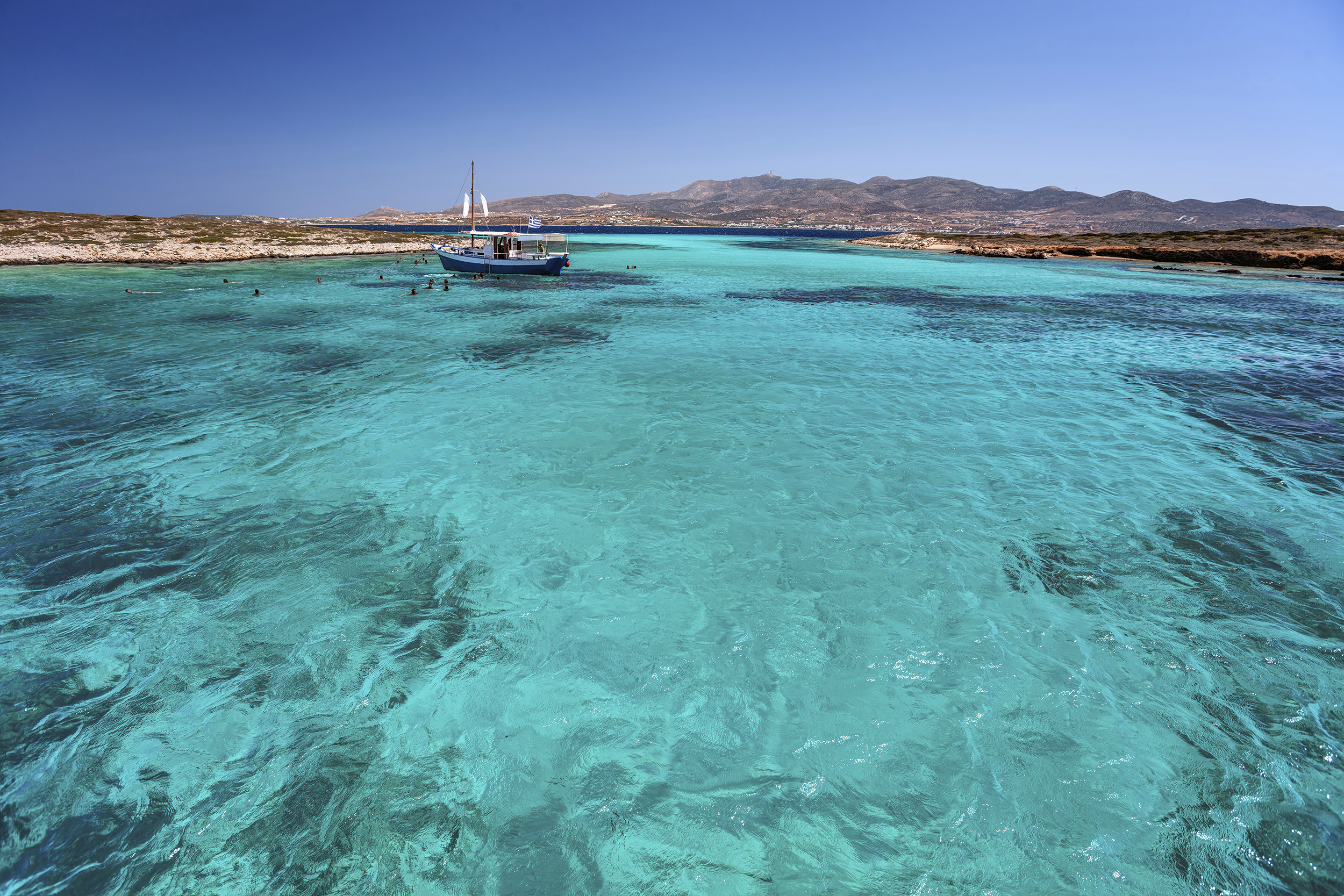 Blue lagoon in Tigani islet between Paros and Antiparos islands,