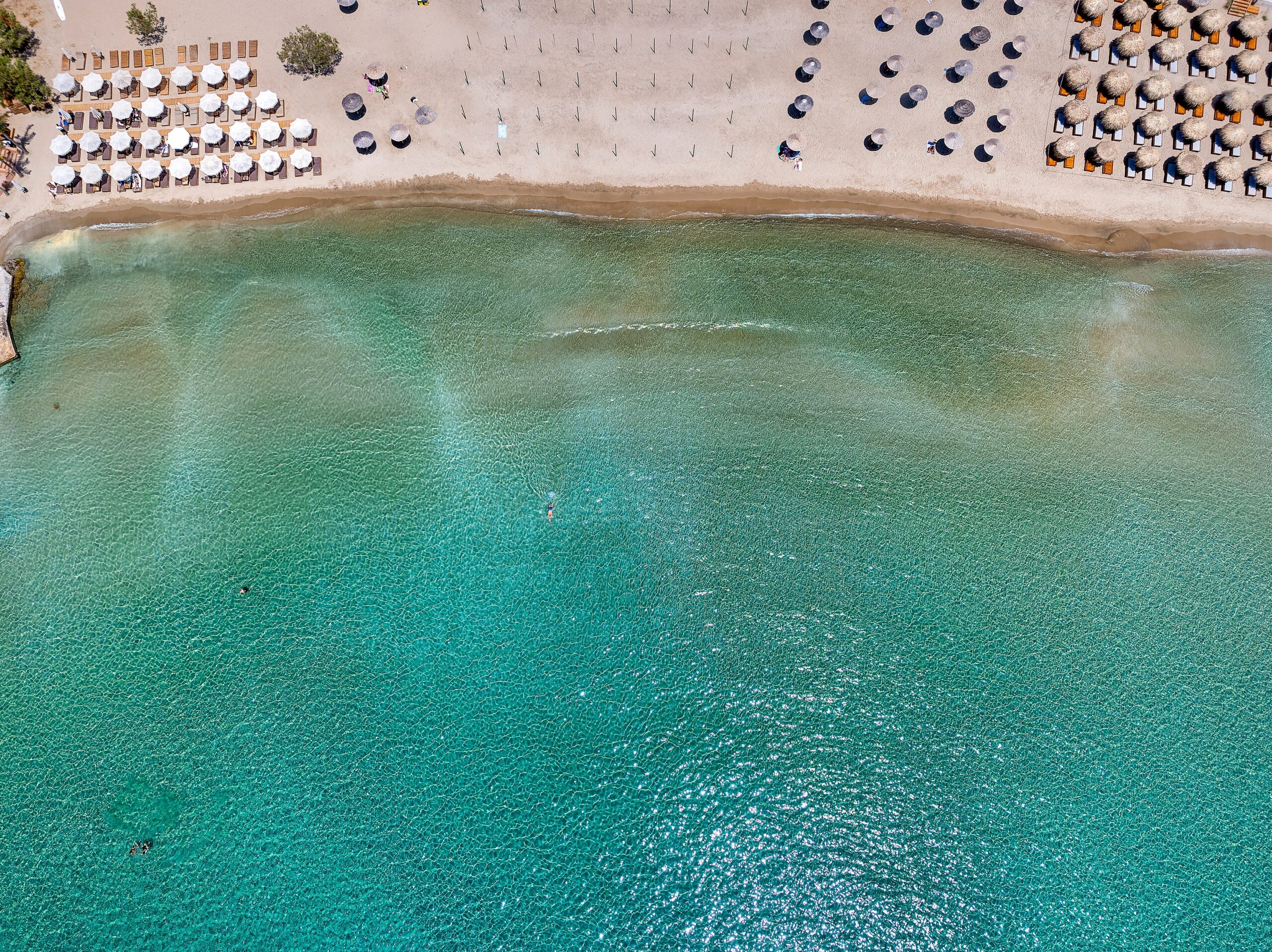Aerial,Top,View,Of,The,Emerald,Sea,At,Agathopes,Beach,