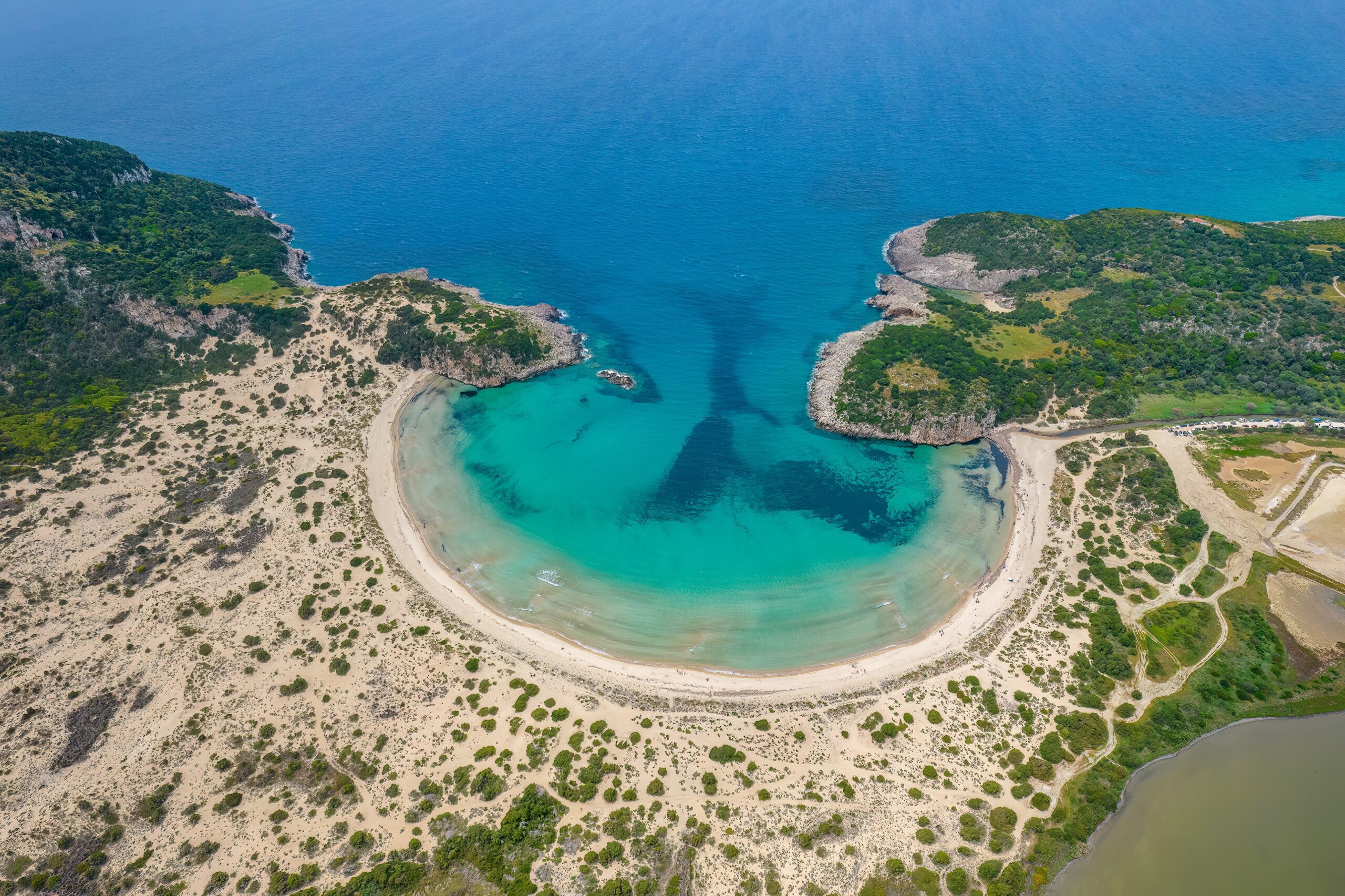Aerial,Drone,Photo,Of,The,Iconic,Semicircular,Sandy,Beach,Of