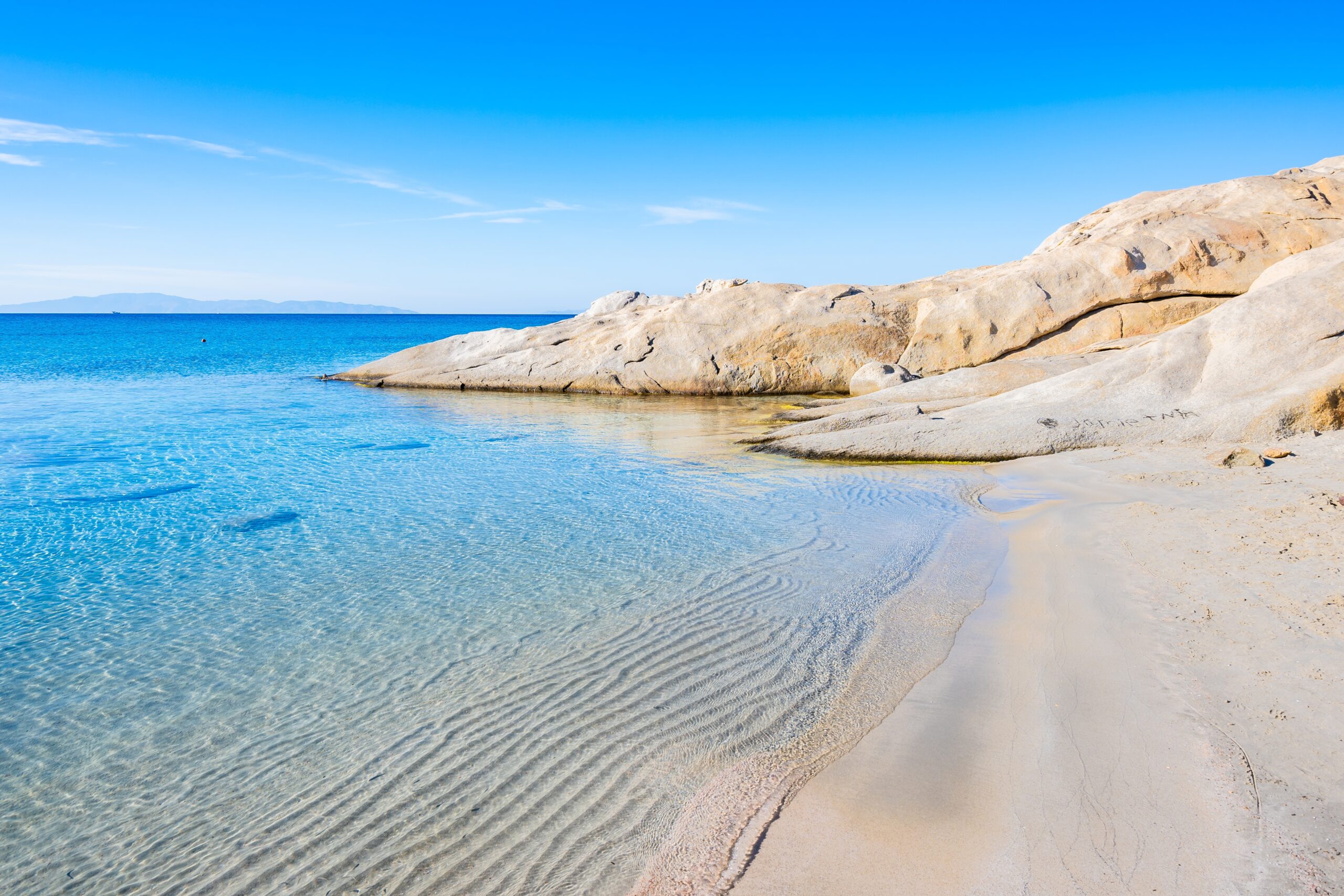 Beautiful,Sandy,Beach,Of,Mikri,Vigla,With,Rocks,In,Azure